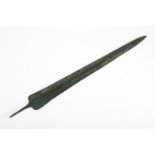 A Luristan bronze short sword, the ribbed, double edged blade on tapered tang, 18" (46cm long).