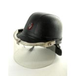 A black, 'Skulgarde' riot helmet, with die-cast crowned harp badge, fitted with padded neck