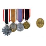 1934-45 German medals, mounted as a group of four and gold wound badge. War Merit Cross, second