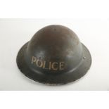 1939-45 A World War II Police brodie helmet, the black shell stencilled 'Police'.