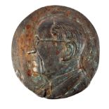 A bronze plaque of Éamon de Valera, the circular bronze plaque centered with a relief portrait bust,