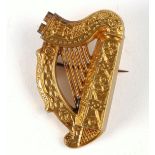 A Victorian Irish gold harp brooch by Hopkins & Hopkins, Dublin, modelled on the Trinity College