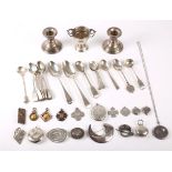 A mixed lot of miscellaneous hallmarked silver, including a miniature trophy cup, a pair of desk