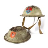 Two Óglaigh na hÉireann brodie helmets with Southern Command flashes. A 1940s example and a 1960s