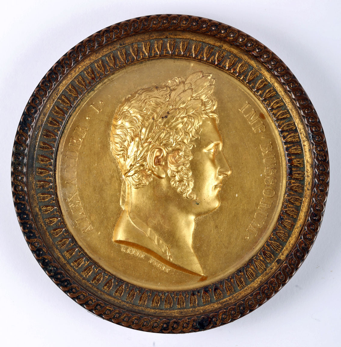 Gilt medal commemorating Tsar Alexander I of Russia. Obverse shows laureate head of the Emperor, and