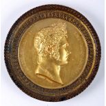 Gilt medal commemorating Tsar Alexander I of Russia. Obverse shows laureate head of the Emperor, and