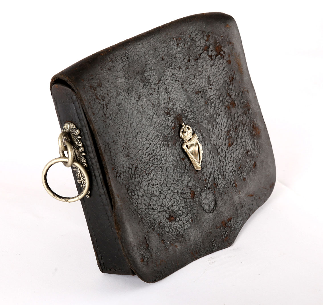 Royal Irish Constabulary. A black leather rectangular dispatch pouch with white metal foliate