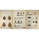 A collection of Army Service Corps and Royal Army Service Corps helmet plates, badges and buttons.