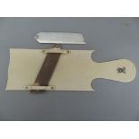 Rare George IV ivory cucumber slicer. The flat ivory board with shaped handle, engraved with crest