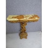 Ornate gilt wood side table with green / brown onyx top. Cherub support, shaped circular pedestal