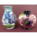 Modern Moorcroft two bulbous shaped vases with pansy and hibiscus decoration both signed by