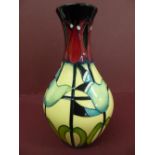 Modern Moorcroft baluster shaped vase with Art Nouveau decoration of stylised flowers signed by