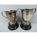Two GV silver two handled trophy cups un-engraved - Sheffield 1929 and 1930 - 13 ozt, maker H A