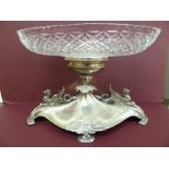 An impressive silver centre piece having oval cut glass fruit bowl to top, the elongated oval base