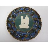 Rare Thomas Bradley porcelain plate fired by Mintons with applied decoration of seated figure to