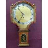 1920s red and black lacquered wall clock with brass dial, silvered chapter ring, Roman numerals,