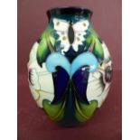 Modern Moorcroft bulbous shaped vase with butterfly and flower decoration signed by Emma Bossons -