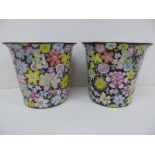 A pair of Chinese porcelain jardinières with multicoloured floral decoration to bodies. Marked to