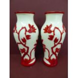 Pair of Chinese red overlay glass vases with a white ground with decoration of prunus and magnolia -