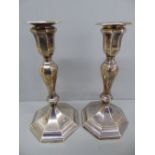 Pair of octagonal loaded silver candlesticks - Sheffield 1910 - maker HE Ltd - ht. 10.25 ins.