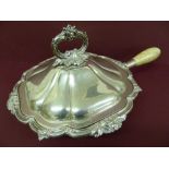 An Edwardian silver breakfast dish with shaped and acanthus leaf decoration to border, with interior