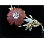 14 ct gold brooch by Cropp & Farr with carved hard stone flower, seed pearl centre and pavé set
