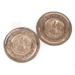 Pair of Continental Grand Tour-Style Silvered Bronze Chargers , 19th c., intricate reliefs of