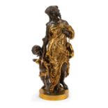 Large Patinated and Gilt Bronze Bacchic Figural Group , cast as a cherubic child holding a ewer