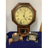 A wall clock by Margarita of Hereford in an oak case with a pendulum window together with two deco