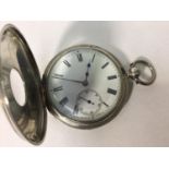A silver-cased half-hunter pocket watch, the white enamel dial with Roman numerals denoting hours