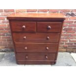 An Edwardian walnut chest of two short and three long graduated drawers, with turned pulls, 98cm