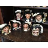 A collection of seven large Royal Doulton character jugs, including Aramis, Athos, D'Artagnan,