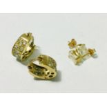 A pair of 9ct yellow gold earrings, pave set with white stones, weighing 4.7 grams. Together with