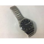 A gents stainless steel Bulova wristwatch, the black dial with silver batons denoting hours and date