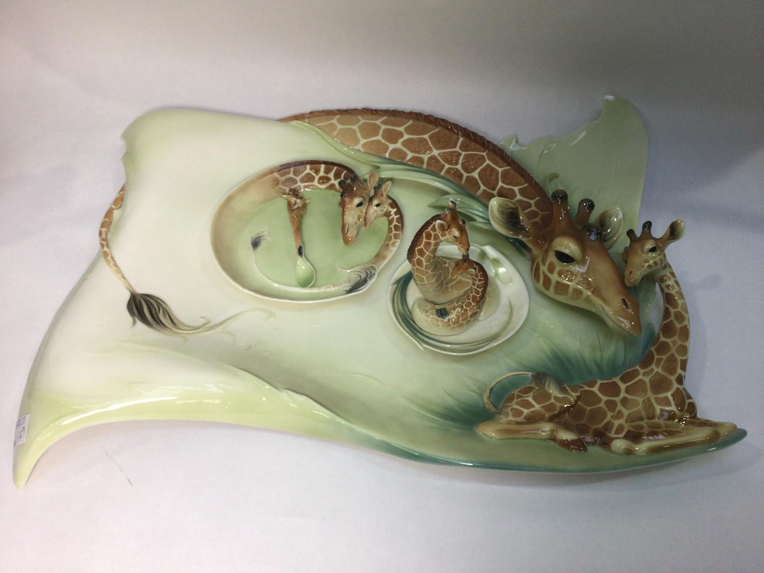 A large 20th century ceramic serving platter with relief giraffe and calf by Franz, limited