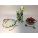 A 20th century ceramic poppy cup, saucer and spoon by Franz, designed by Kuei Mei and sculpted by