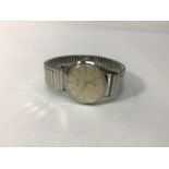 A gents stainless steel Longines 7111-1, the silvered linen dial with gilt batons denoting hours and