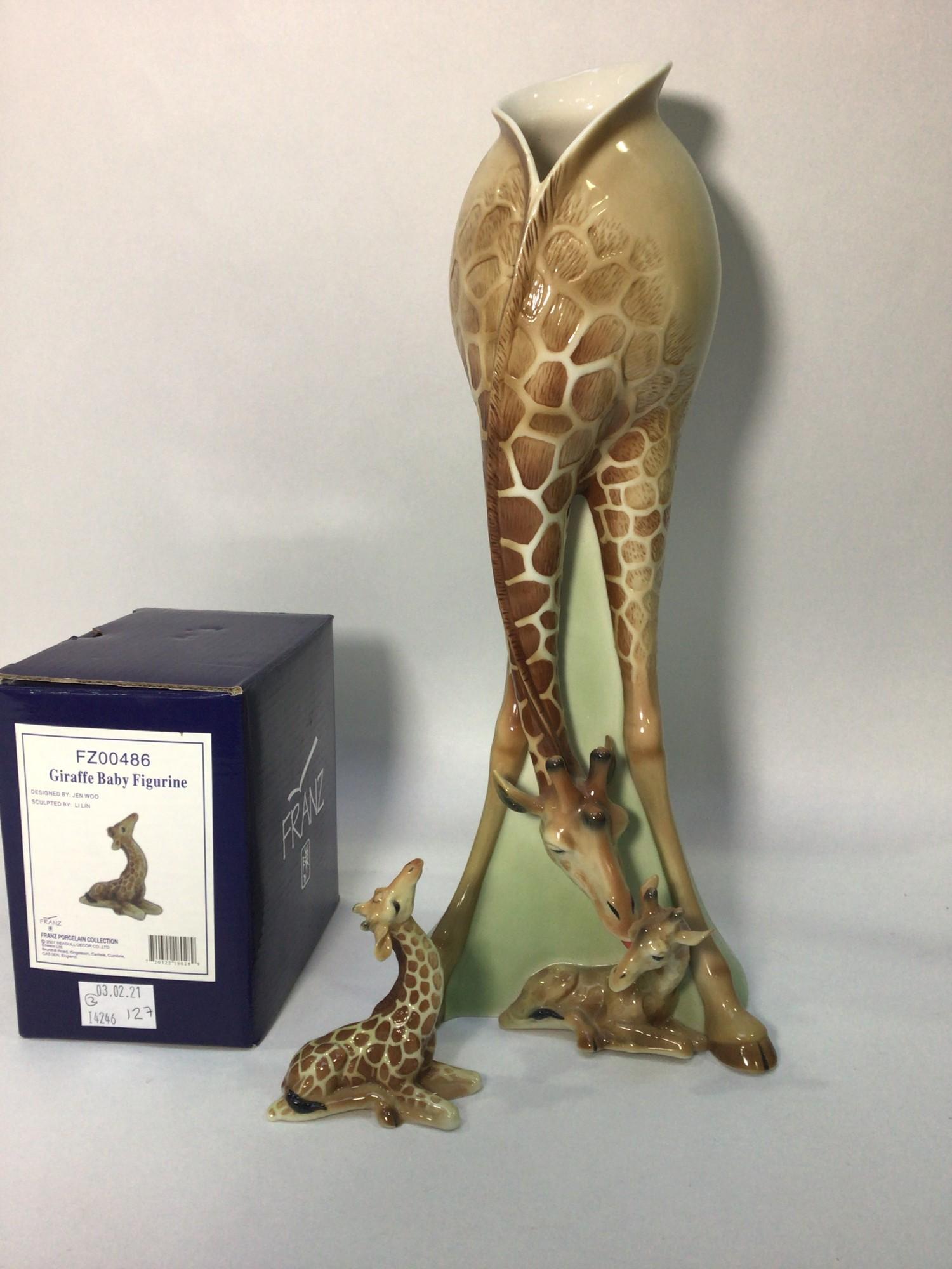 A large 20th century ceramic vase shaped as a giraffe licking her calf, by Franz, signed to base,