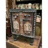 Ethnic free standing carved corner cabinet with detailed carving, iron bolt lock, roped edging and