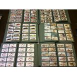 A large collection of cigarette cards comprising six albums approximately 6000 cards in sets and all