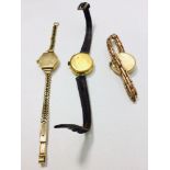 Three ladies wristwatches, two with 9ct gold cases, one 18ct gold cased, one on rolled gold bracelet