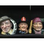 A collection of large Royal Doulton character jugs, including Groucho Marx, Glenn Miller, Louis