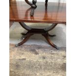 A stained oak jardiniere table in the Liberty 'Style' with carved clover-leaf top and undertier on