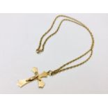 A 9ct yellow gold chain measuring 24 inches, with a 9ct yellow gold crucifix, total weight 7.6