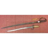 A French Chassepot bayonet with Yataghan fullered blade, 22.75 inch, and ribbed brass grip, scrolled