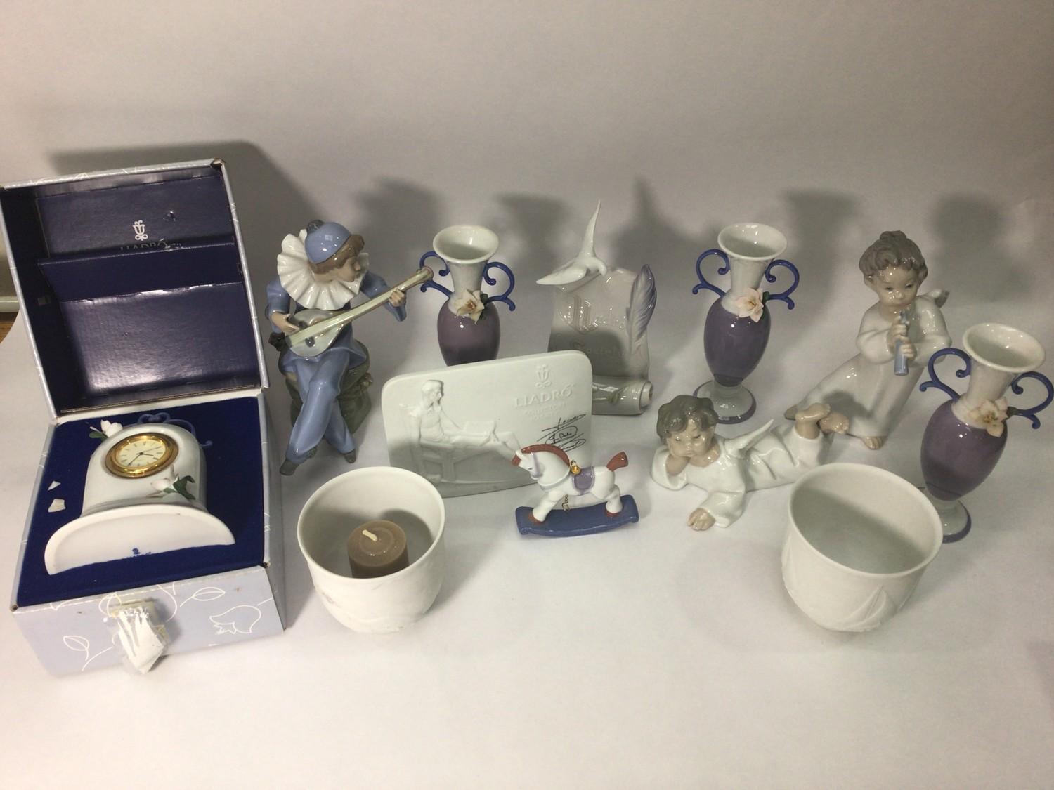 Various Lladro porcelain including two angels, three posy vases, signed plaque, rocking horse