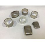 Two various silver vesta cases and five assorted silver napkin rings, gross weight approximately 4.