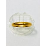 A 22ct gold wedding ring, finger size M, weight 3.4 grams.