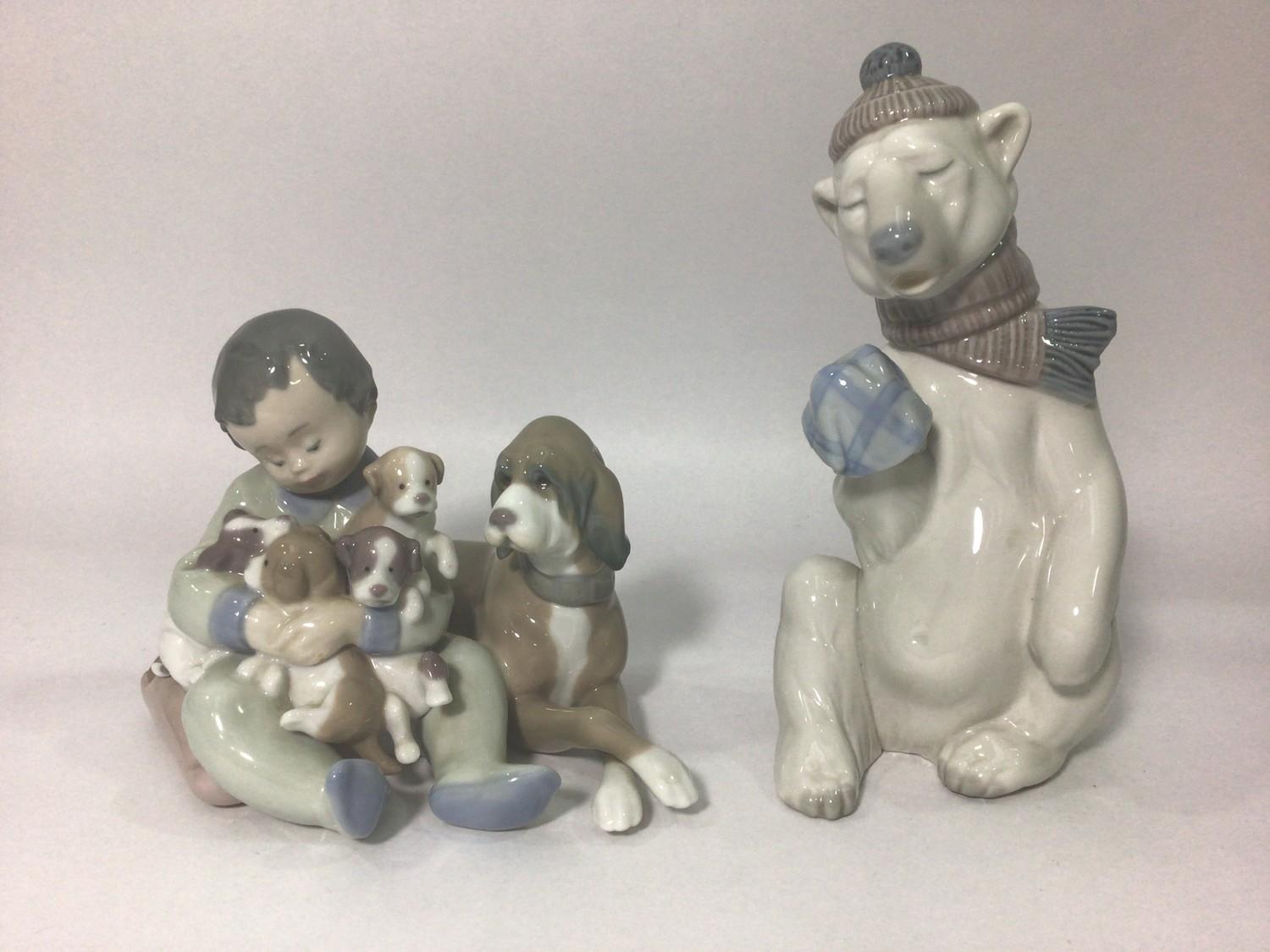 A Lladro porcelain figure 'Painful Bear No. 5021', 18.5cm high, together with a Lladro figure