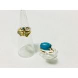 A 9ct gold dress ring set with an oval cabochon cut turquoise in a four claw setting, weighs 2.9